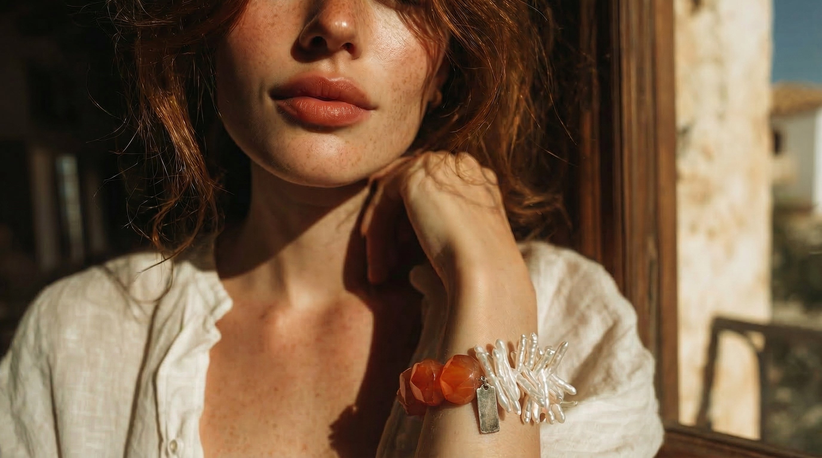 Handmade Kinsoul Energy bracelets — natural pearls and gemstones in soft natural light