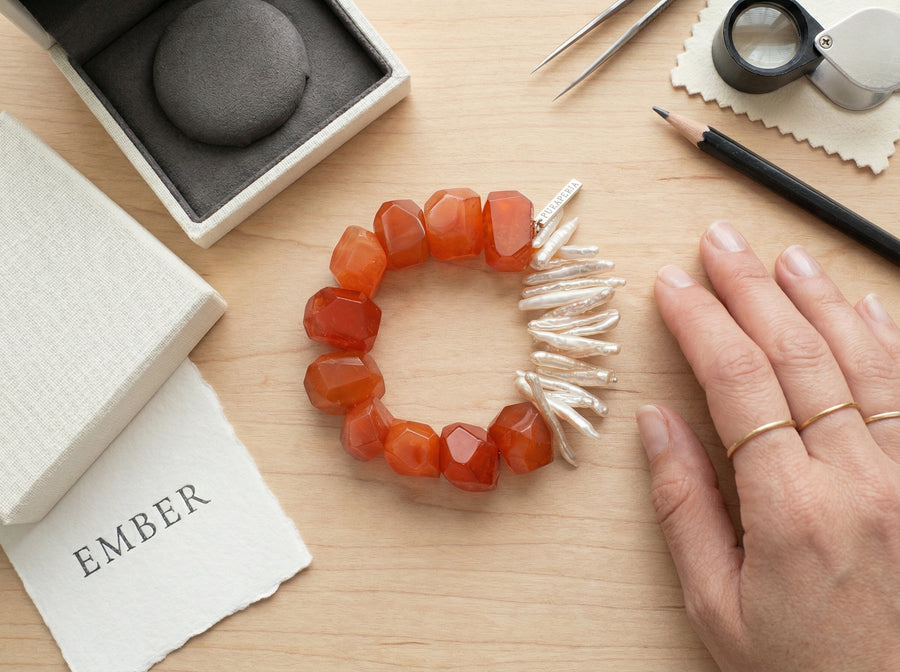 Final inspection of a finished Kinsoul Energy bracelet before it ships to a customer